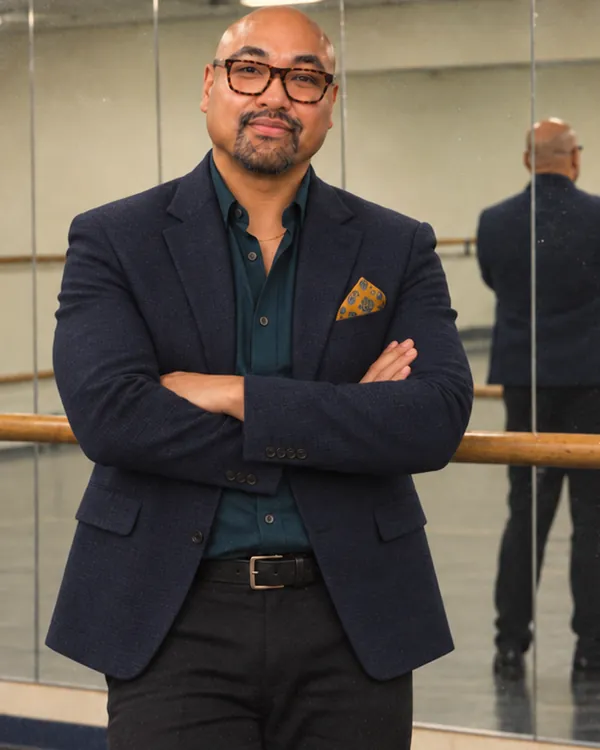RJ, chief operating officer, standing in the dance studio.